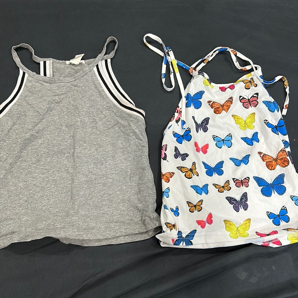gray halter top is a medium. blue butterfly halter top is a small